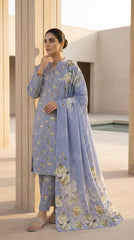 Model in a periwinkle blue 3-piece unstitched lawn suit with ivory botanical floral print, arms crossed, front view