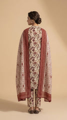 Close-up portrait of a model in an antique ivory botanical lawn suit with a contrast ikat stripe chiffon dupatta draped across the chest, antique gold jhumka earrings, Mughal stone wall background