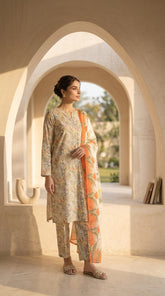 Model smiling and walking with the coral tulip bamber chiffon dupatta spread wide, ivory wildflower printed lawn suit and matching printed trouser