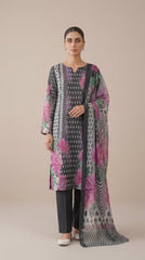 Model seated on carved stone steps in a Mughal courtyard wearing a charcoal grey luxury lawn suit with ikat dot and magenta chrysanthemum print, plain charcoal shalwar, and matching printed lawn dupatta with chevron border pooling on the steps, warm sandstone background