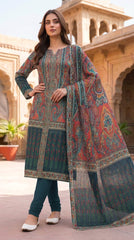Back view of a model turning and smiling in a Mughal courtyard in a terracotta red luxury lawn suit with all-over paisley jaal print, plain teal shalwar, and matching teal chiffon dupatta with oversized paisley print trailing behind, warm golden light