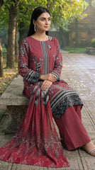 Model seated on a carved stone bench in an autumn garden in a dusty mauve luxury lawn suit with scattered black and white peony print, vertical geometric placket panel, plain mauve shalwar, and matching printed lawn dupatta with oversized grey peony blooms pooling on the bench