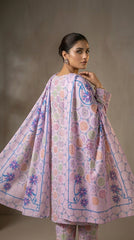 Back view of a model holding out the matching lilac bamber chiffon dupatta with bold blue-outlined tropical star florals and structured geometric border, soft lilac pastel medallion lawn suit visible underneath, warm grey background