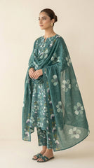 Back view of a model in a pine green Pakistani luxury lawn suit with watercolour dogwood floral print and a matching embroidered bamber chiffon dupatta, standing under a stone arch