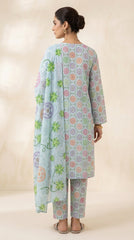 Full length side view of a model walking in a powder blue Pakistani luxury lawn suit with multicolour pastel medallion print, matching printed trouser, and contrast oversized tropical floral chiffon dupatta, beige studio background