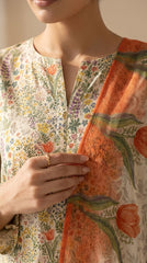Portrait of a model in an ivory wildflower lawn suit holding the coral tulip bamber chiffon dupatta, gold circular earrings, soft studio lighting