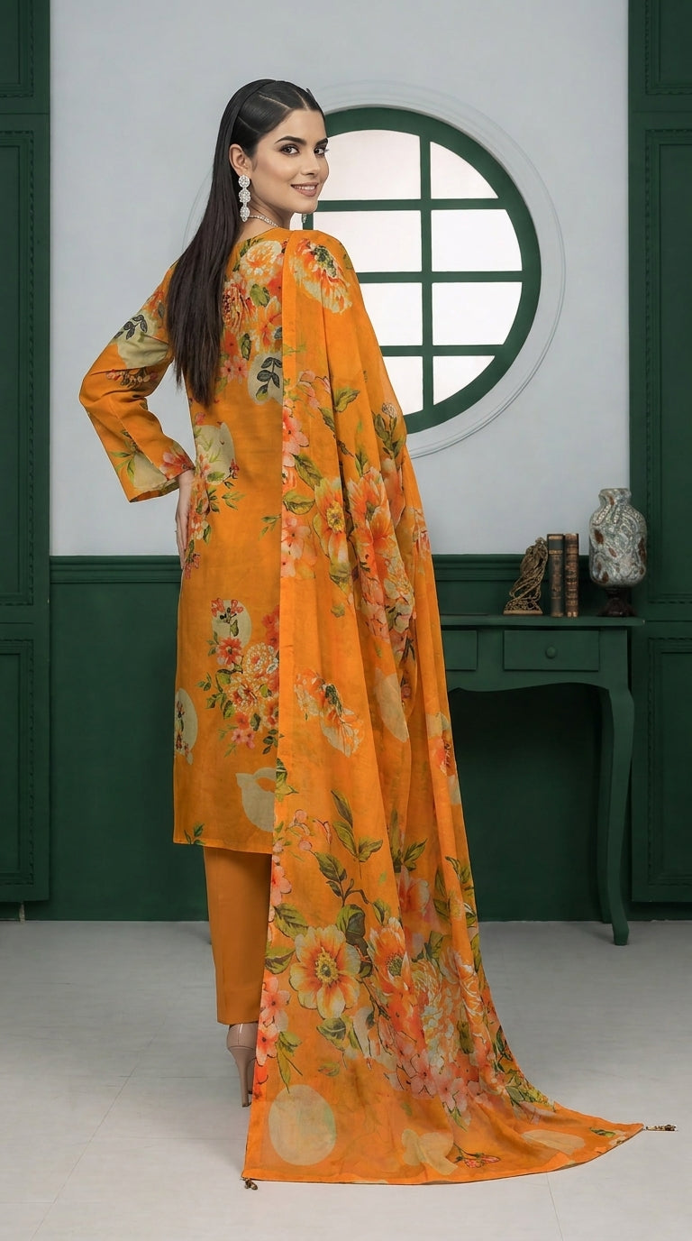 Model seated gracefully on a Persian rug in a green-panelled studio with circular window, wearing a marigold orange luxury lawn suit with all-over oversized watercolour peony and hibiscus floral print, V-notch neckline with fabric button placket, plain orange cigarette trousers, and matching printed lawn dupatta with coral border pooling on the rug